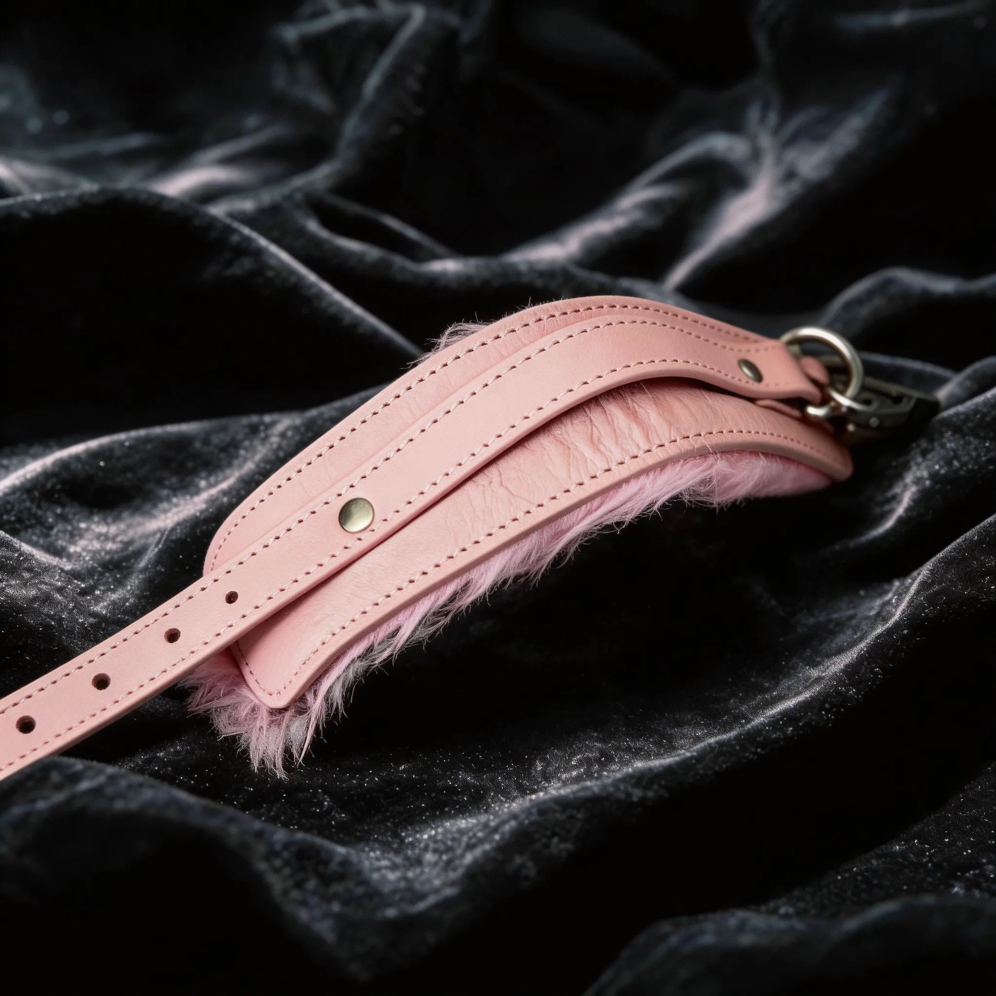 Blush Bond leather wrist cuffs detail view with smooth blush leather exterior and polished hardware