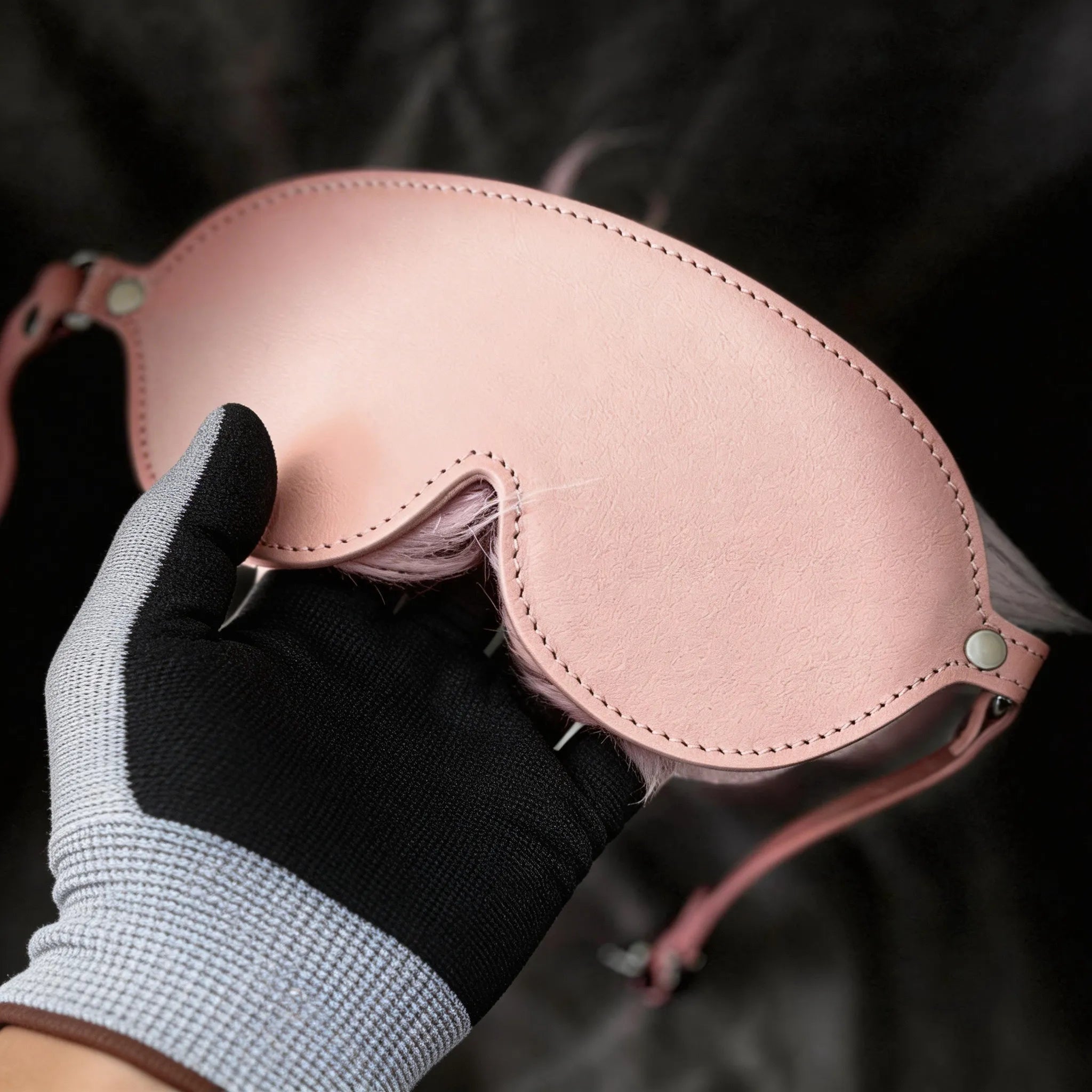Blush Veil leather blindfold model-worn scene with matching cuffs and plush faux-fur trim