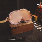 Blush Veil leather blindfold studio workbench scene with blush leather exterior and faux-fur edge