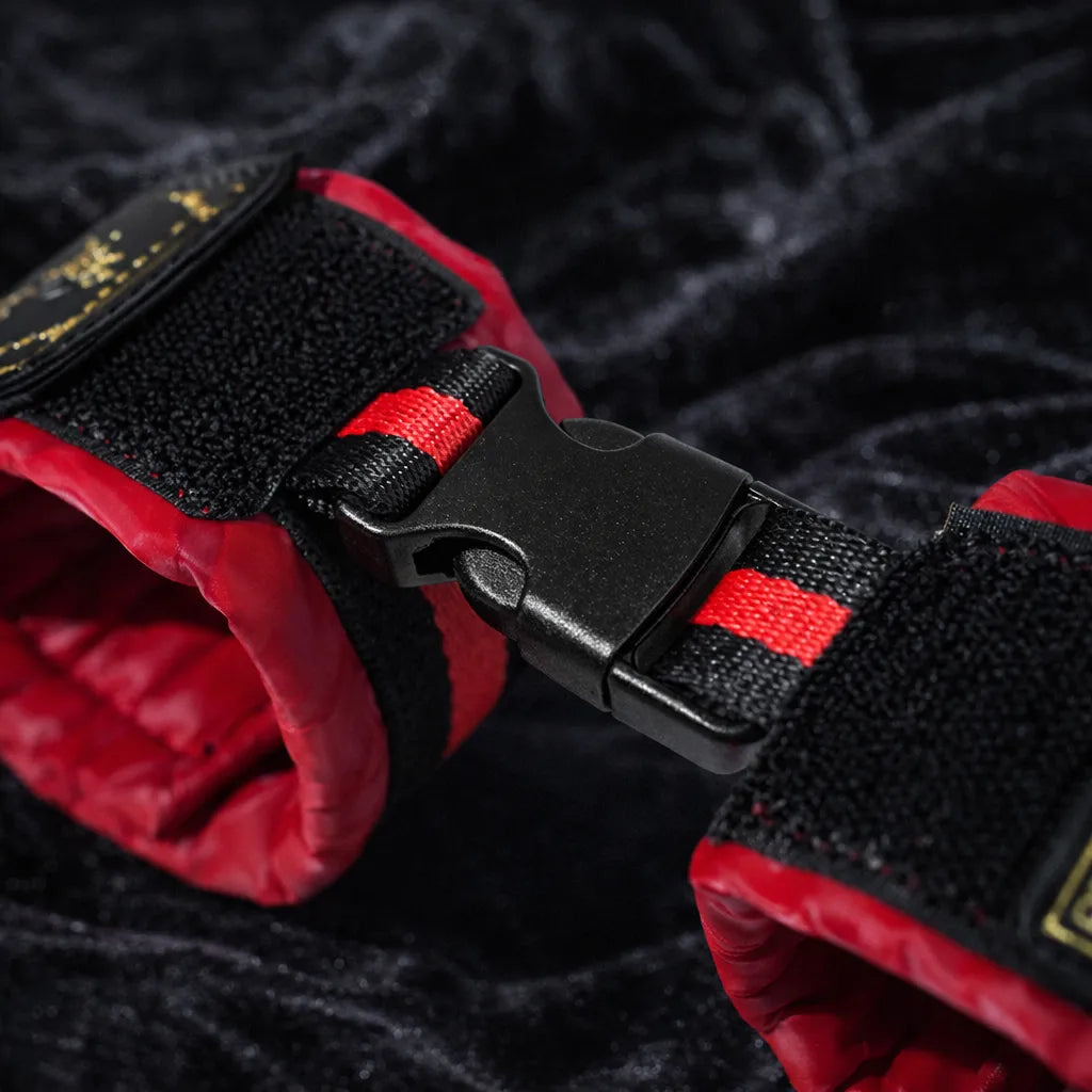 Crimson Order restraint set detail view with soft padded interior and structured cuff shape