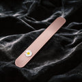 Daisy Hush Slim Leather Spanking Paddle blush pink leather slim paddle on black satin with daisy accent.
