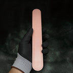 Daisy Hush Slim Leather Spanking Paddle red satin detail showing blush pink leather and daisy accent.