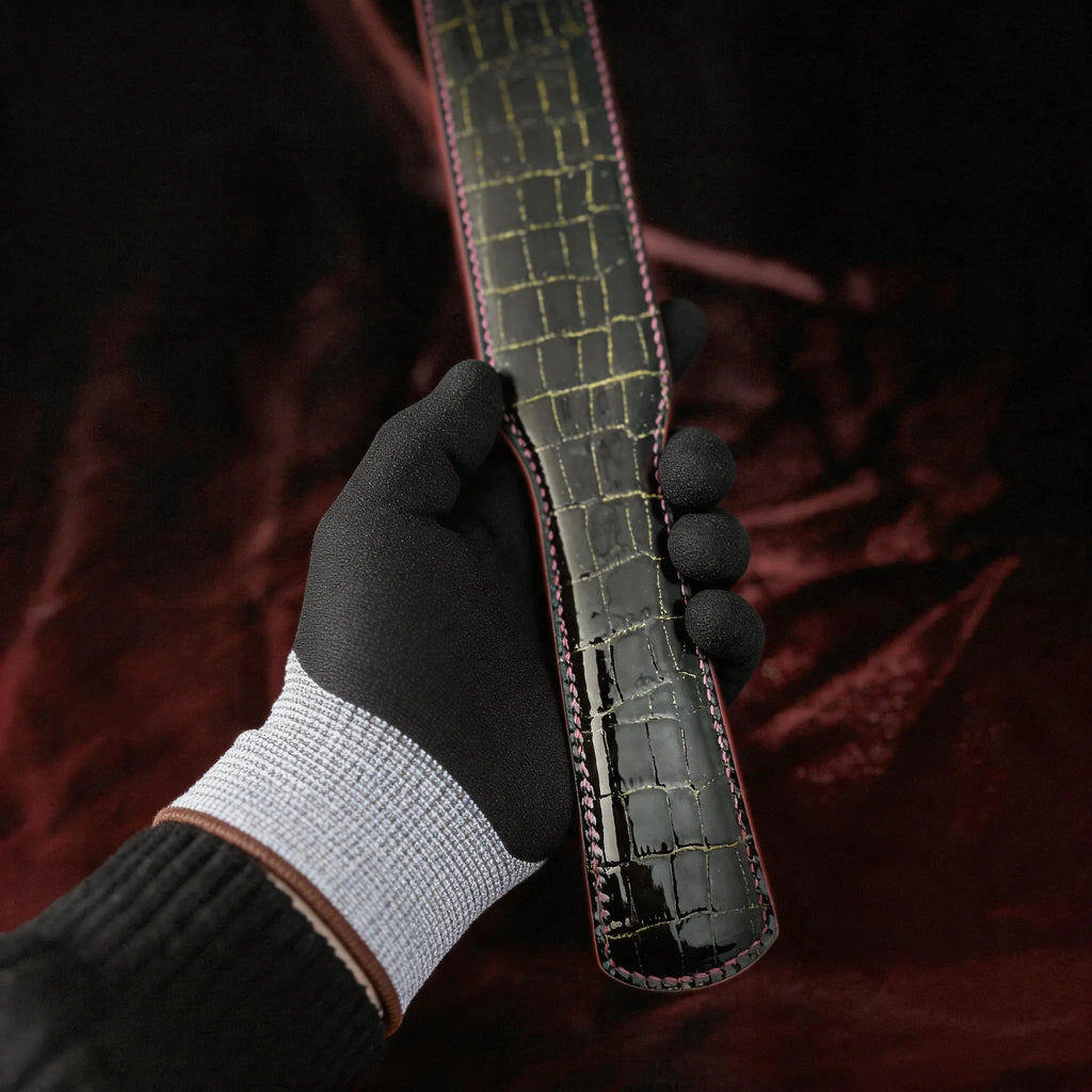 Noir Grid Patent Texture Leather Paddle red satin detail showing black leather and grid texture.