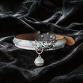 Python Echo Bell Leather Collar white and black python-textured leather collar on black satin with bell charm.
