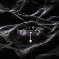Python Star Pendant Leather Collar purple and black python-textured leather collar on black satin with star pendant.