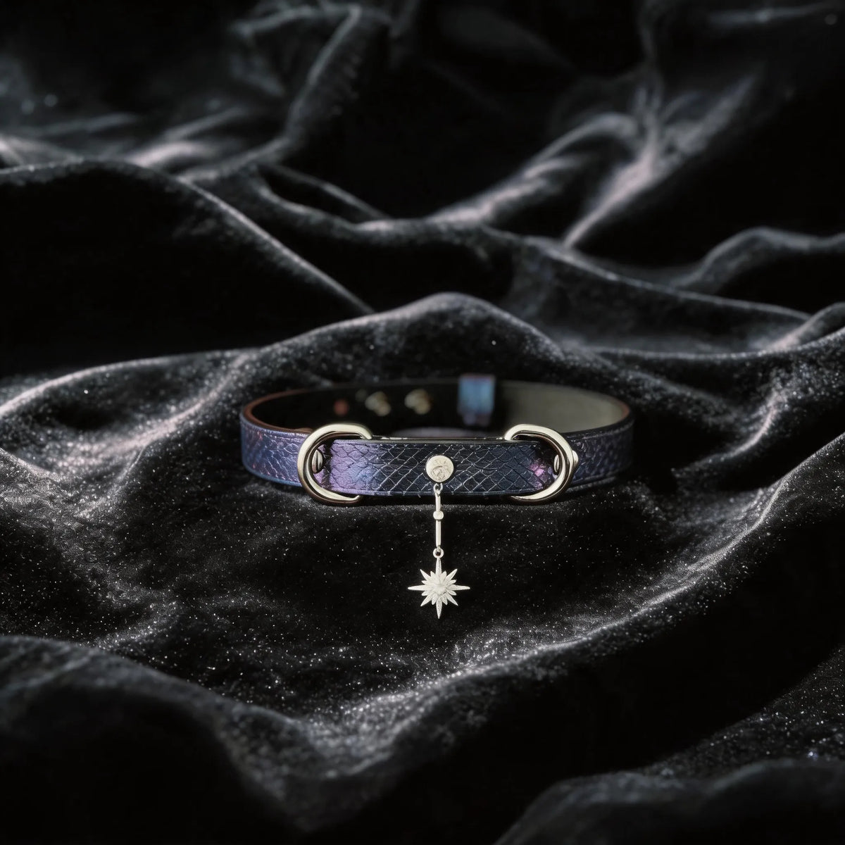 Python Star Pendant Leather Collar purple and black python-textured leather collar on black satin with star pendant.