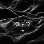 Python Star Pendant Leather Collar purple and black python-textured leather collar on black satin with star pendant.
