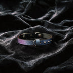 Python Star Pendant Leather Collar hand-held studio detail showing star pendant and silver hardware.