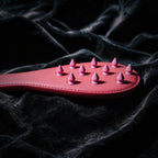 Rose Thorn leather paddle detail view with sculptural surface texture and rounded edge finish