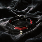 Serpent Mark Pendant Leather Collar hand-held studio detail showing serpent pendant and silver hardware.