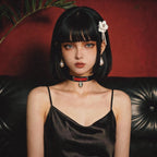 Serpent Mark Pendant Leather Collar model-worn studio scene showing black and crimson leather and serpent pendant.