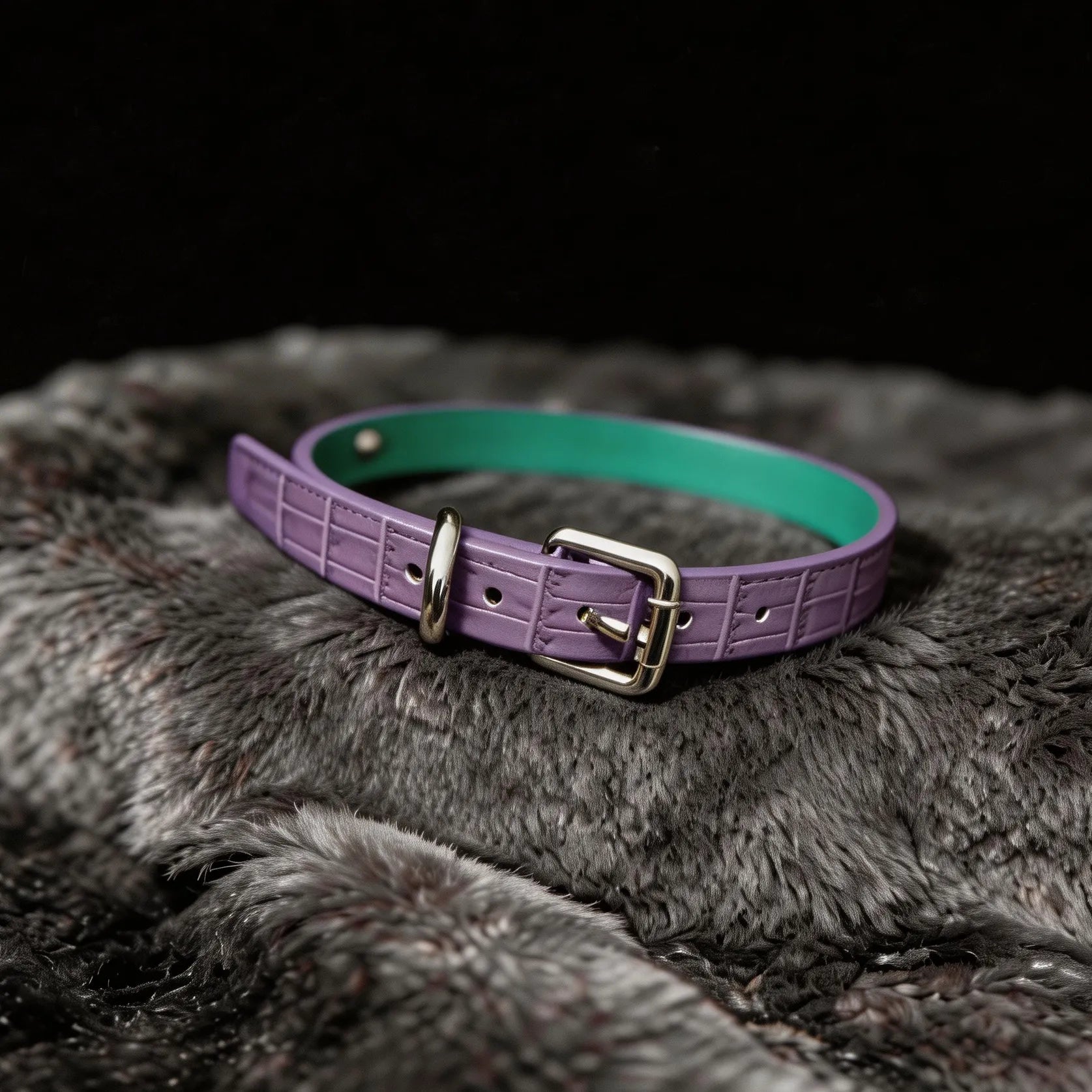 Violet Flutter leather collar detail view with butterfly centerpiece, floral chain drape, and silver-tone hardware